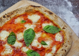 pizza with green leaf on top