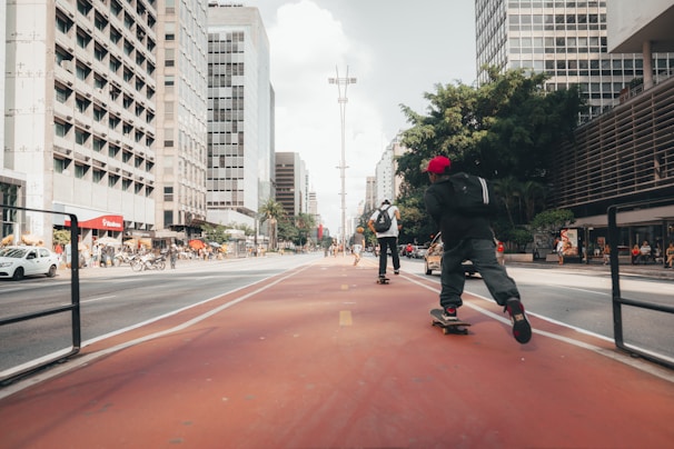 Skateboarders riding through a vibrant Indian street, showcasing the decks in action.