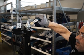 person holding black and silver steel tool