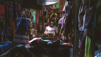 man in white crew neck t-shirt sitting on chair