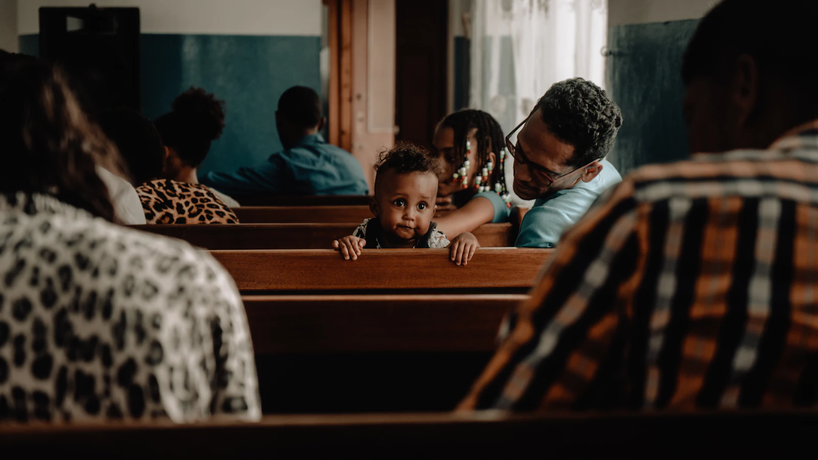 A family in the pews during a service