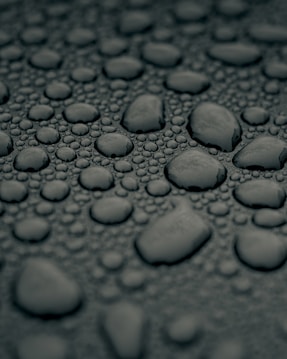 water droplets on gray surface