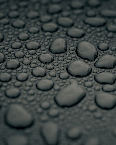 water droplets on gray surface