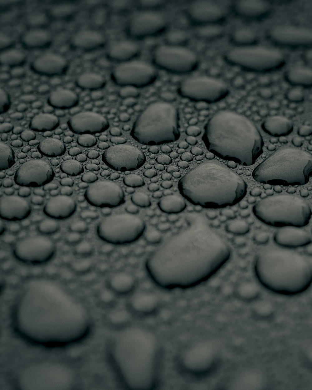 water droplets on gray surface