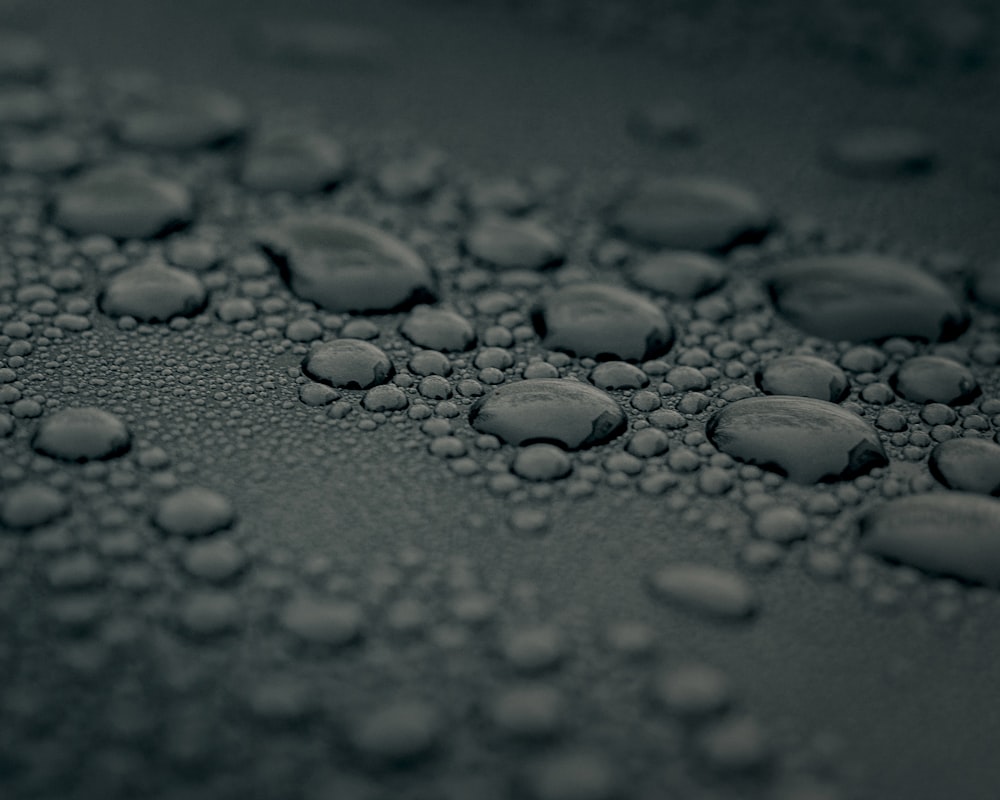 water droplets on gray surface