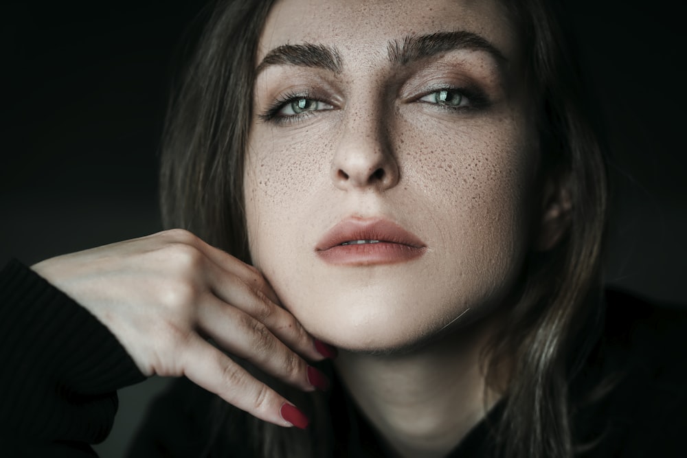 woman with red lipstick and black mascara