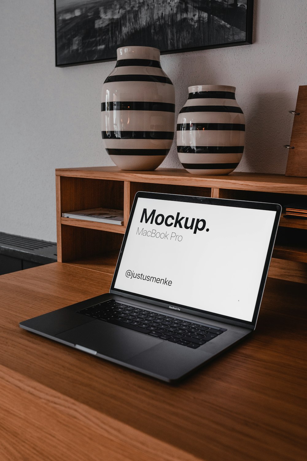 black and silver laptop computer on brown wooden table