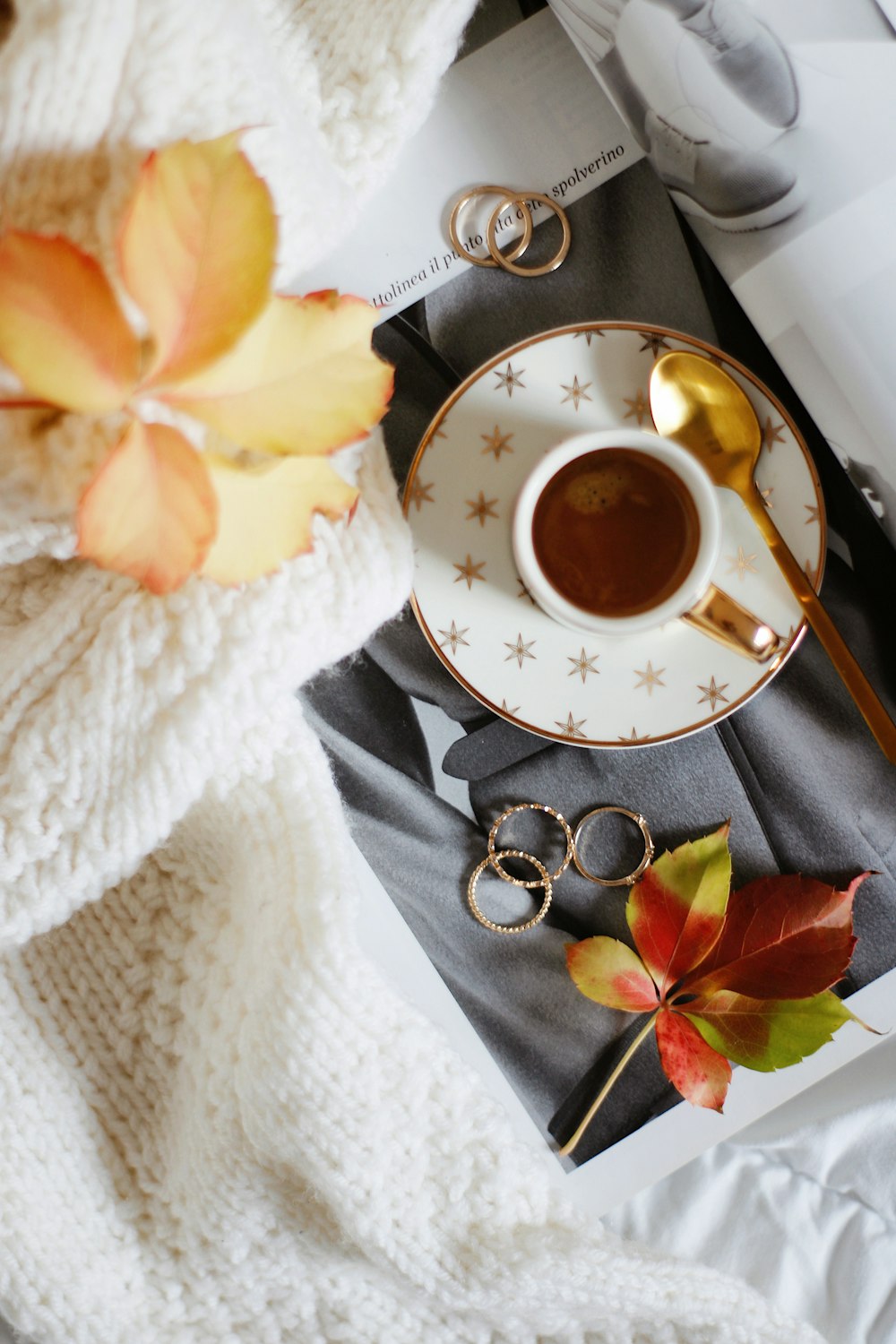 white ceramic cup on white ceramic saucer