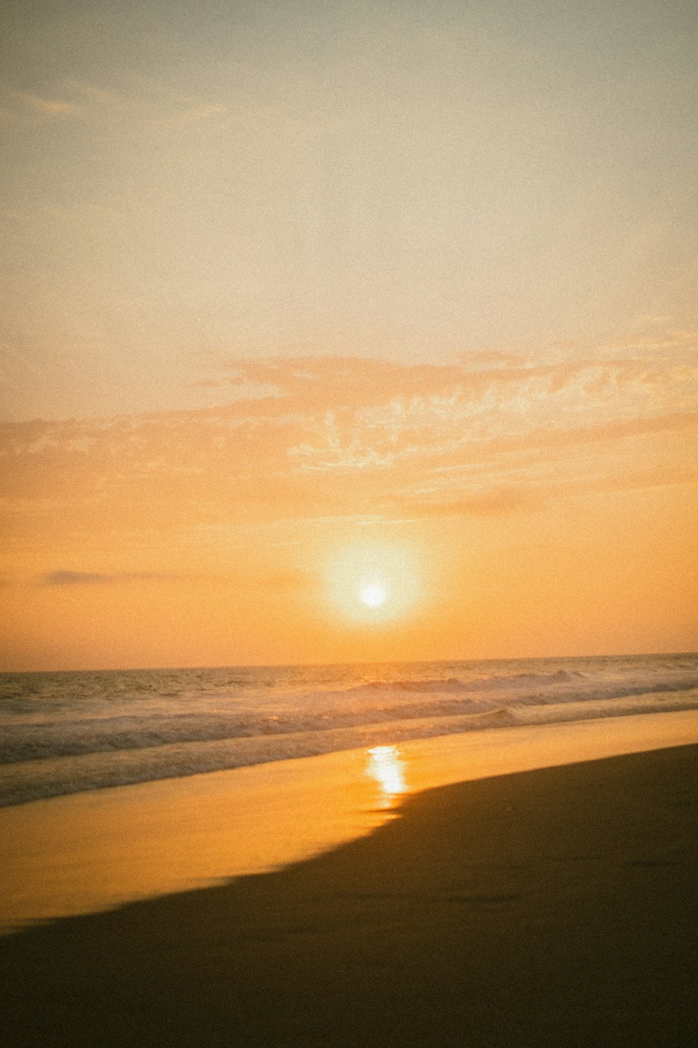 body of water during sunset