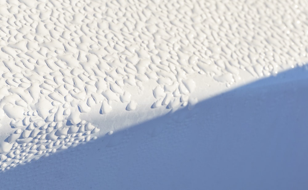 water droplets on gray surface