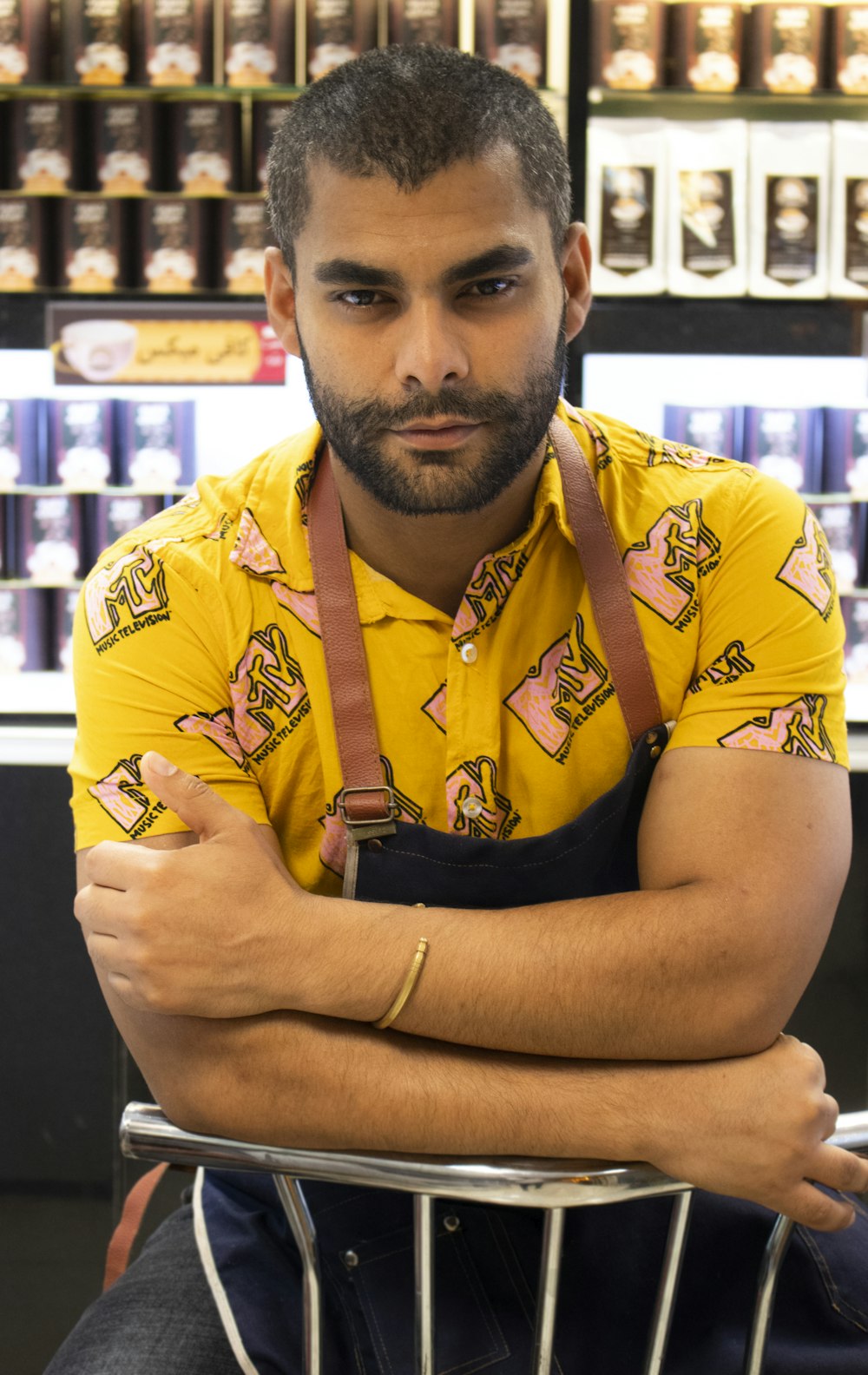 man in yellow and black floral polo shirt