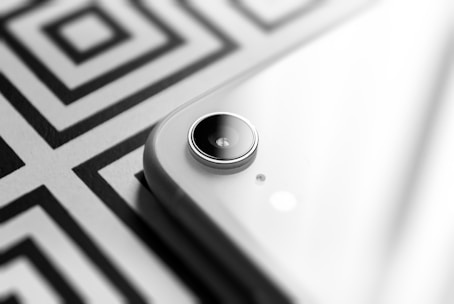 round black button on white and black textile