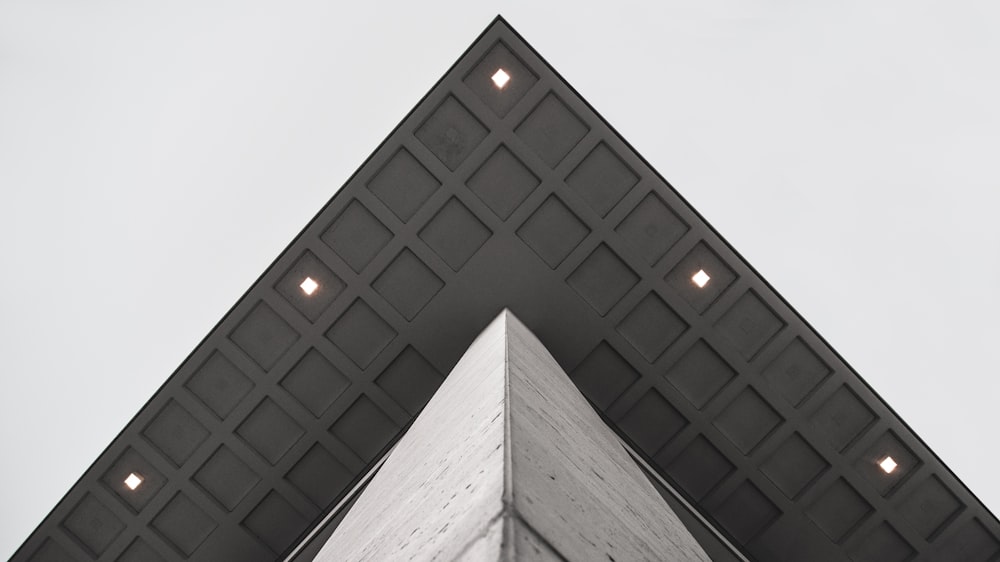 low angle photography of gray concrete building