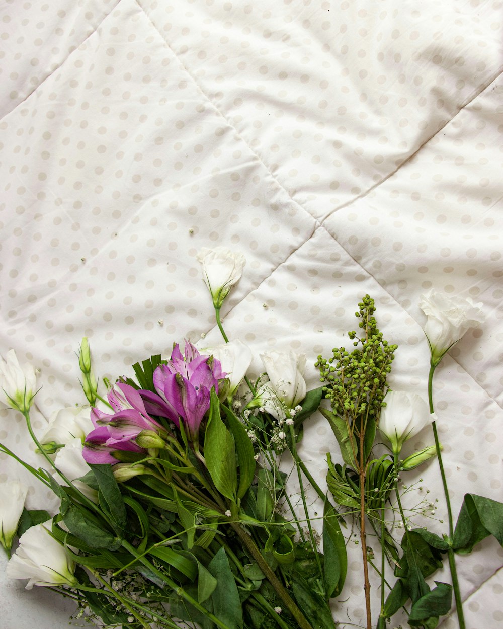 purple flowers on white textile