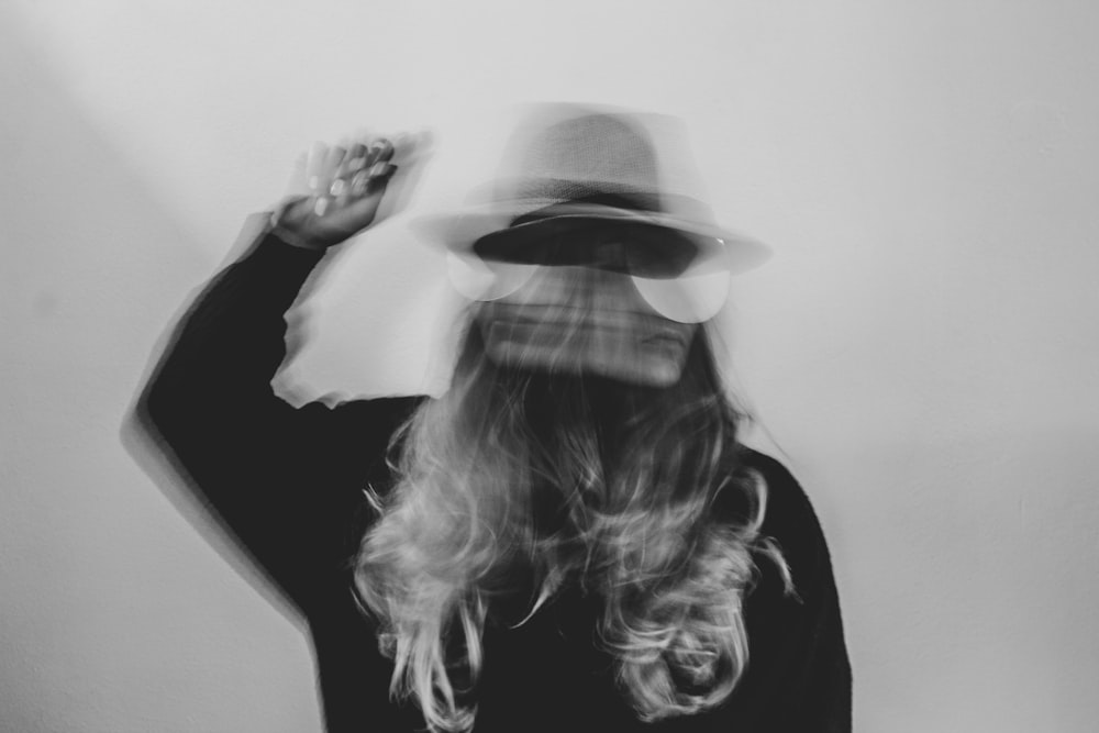 woman in black shirt wearing white hat