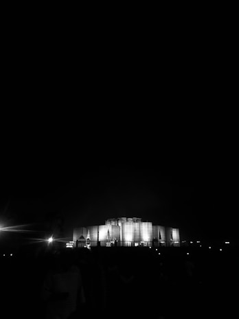 Nighttime shot of an iconic large-scale project illuminated to emphasize its architectural grandeur.