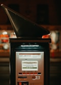 A parking pay station with a sign indicating that no cash is accepted. The screen displays a message stating that the pay station is currently not in operation and timed parking is in effect until October 30, 2020. Various buttons and informational markings are visible on the pay station.