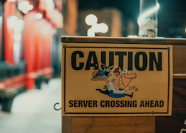 A warning sign overlaying a social media profile of a known scammer.