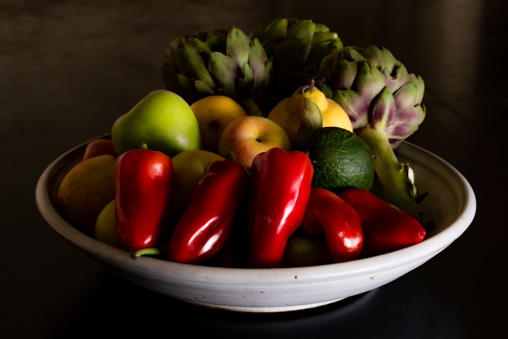 red and green bell peppers on white ceramic plate