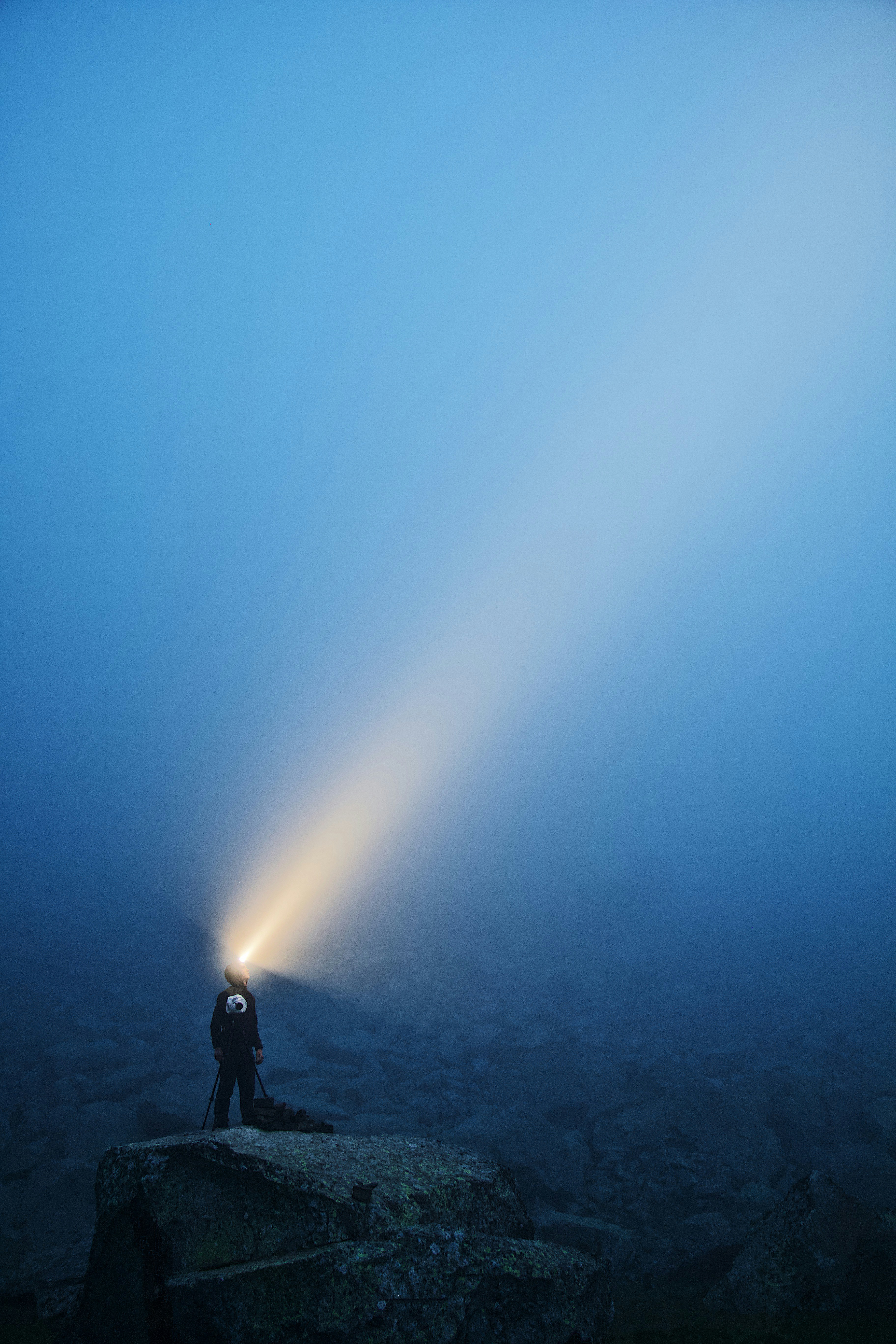 man in black jacket standing under blue sky during daytime