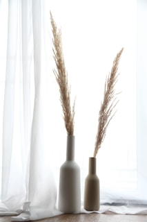 black and white bottles on white surface