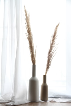 black and white bottles on white surface