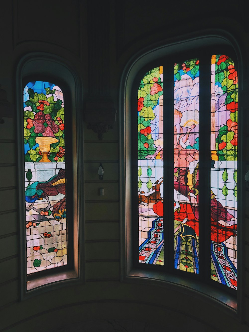 white blue red and green floral glass window