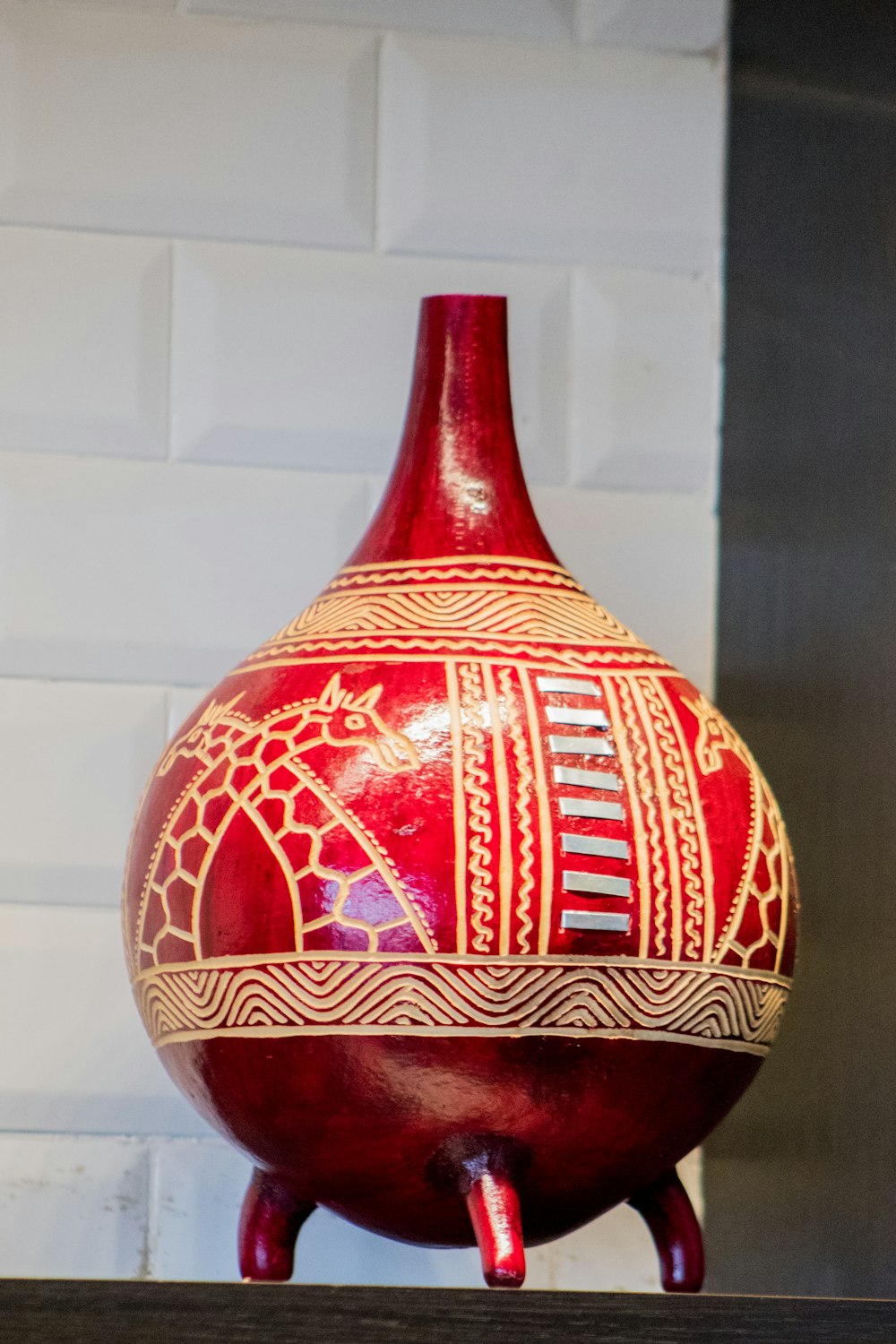 red and brown ceramic vase