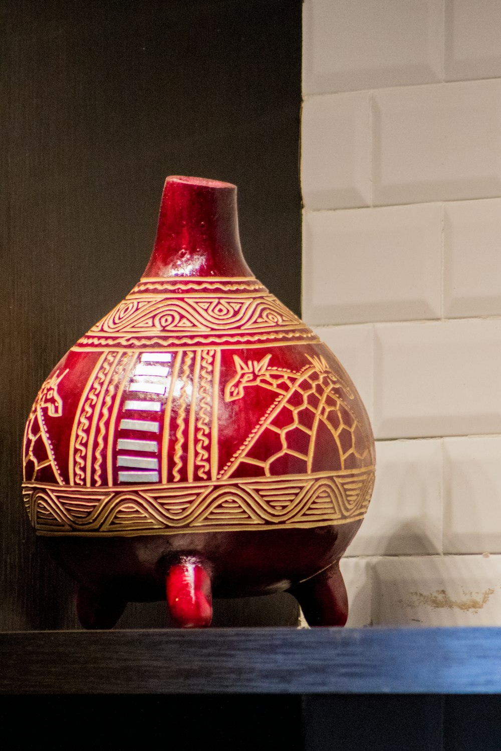 red and brown ceramic vase