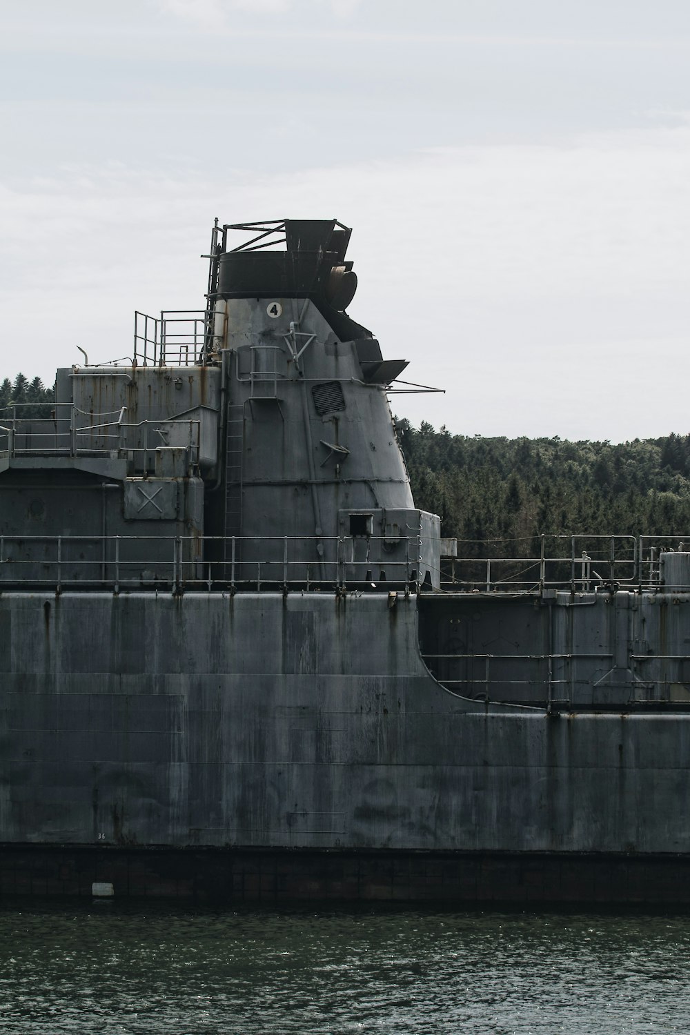 gray metal tank on water