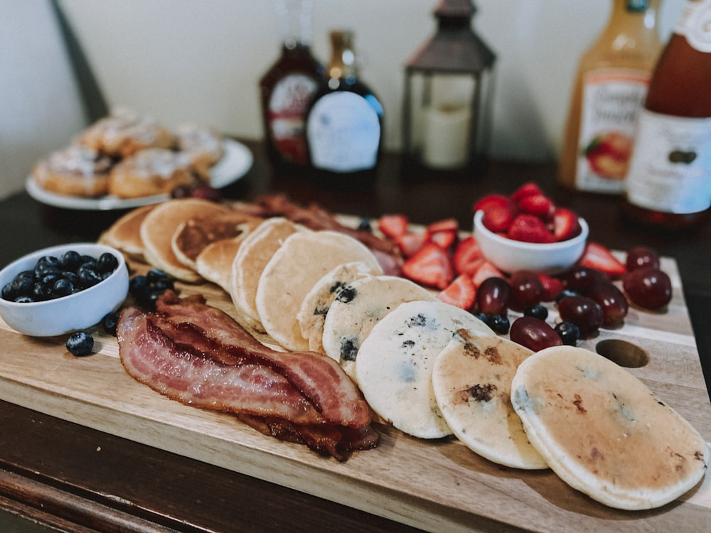 sliced meat on brown wooden chopping board