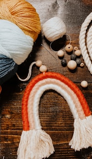 blue and orange yarn on brown wooden table