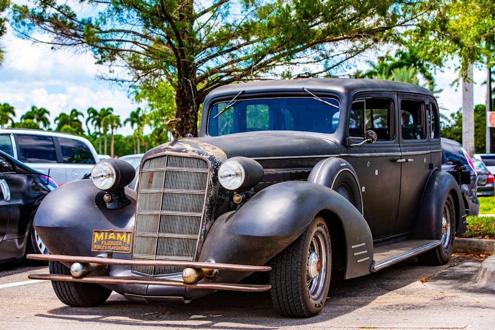 black vintage car on road during daytime