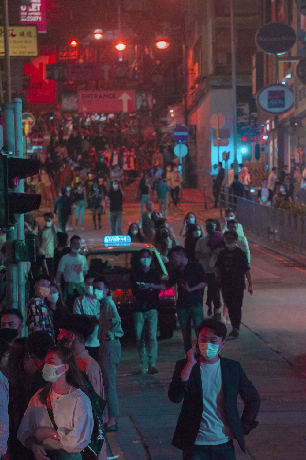 people walking on street during night time