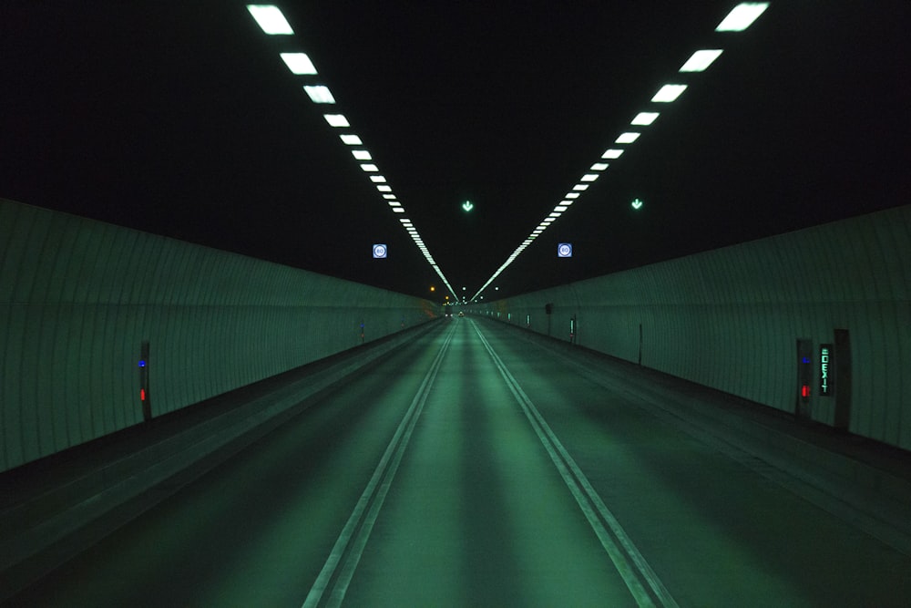 green and white tunnel with lights