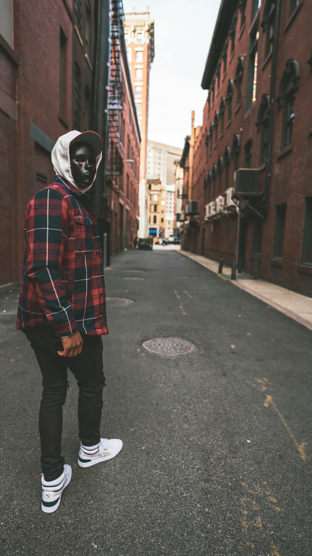 Person in red and black plaid dress shirt and black pants white helmet standing on on photo – Free Providence Image on Unsplash