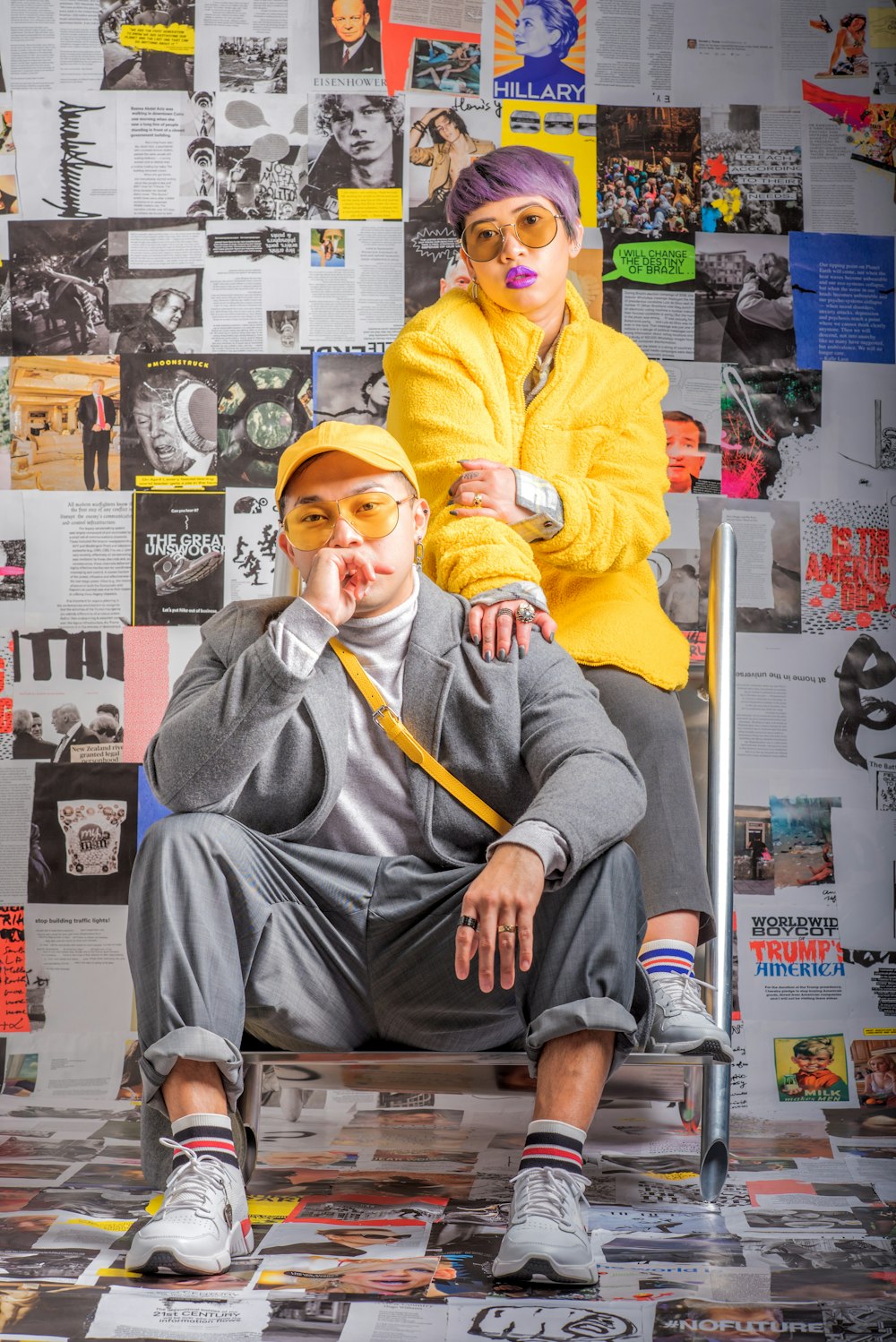 man in gray jacket and yellow knit cap sitting on brown wooden chair