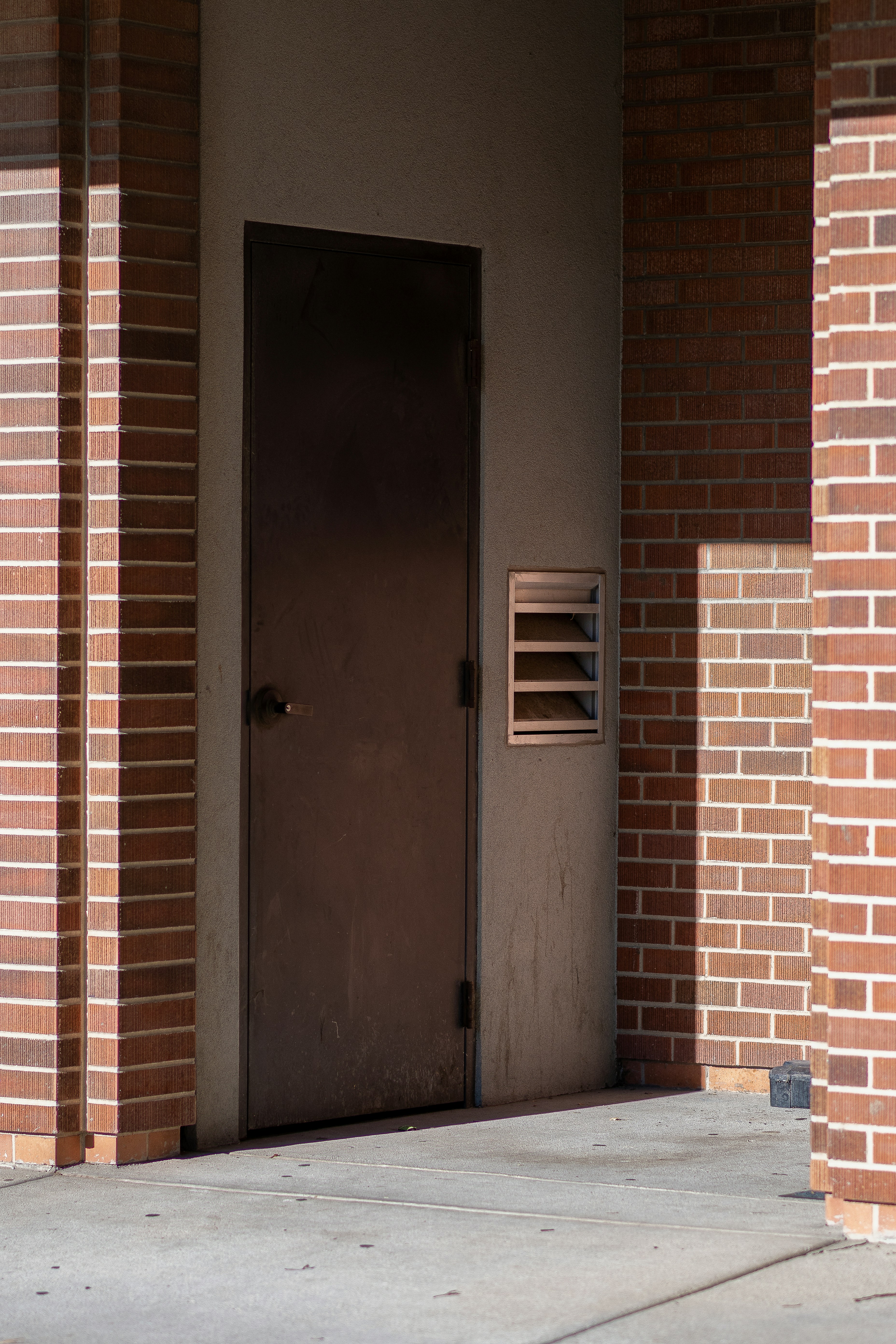 Gray wooden door with silver door lever photo Free Door Image on Unsplash