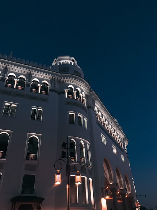 low angle photography of gray concrete building under blue sky during daytime in Algiers Algeria