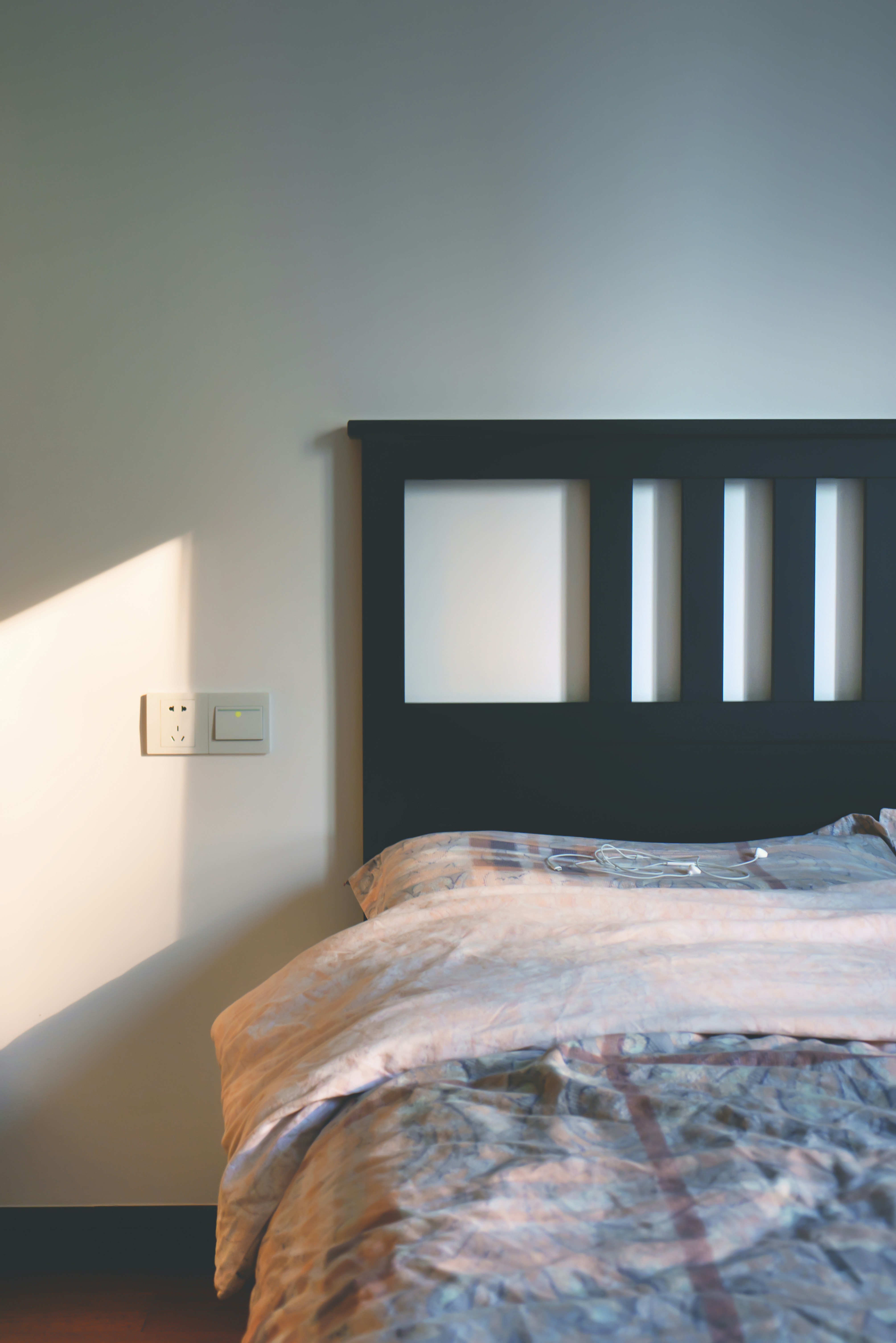Smart plug plugged into wall outlet representing best smart home devices for beginners
