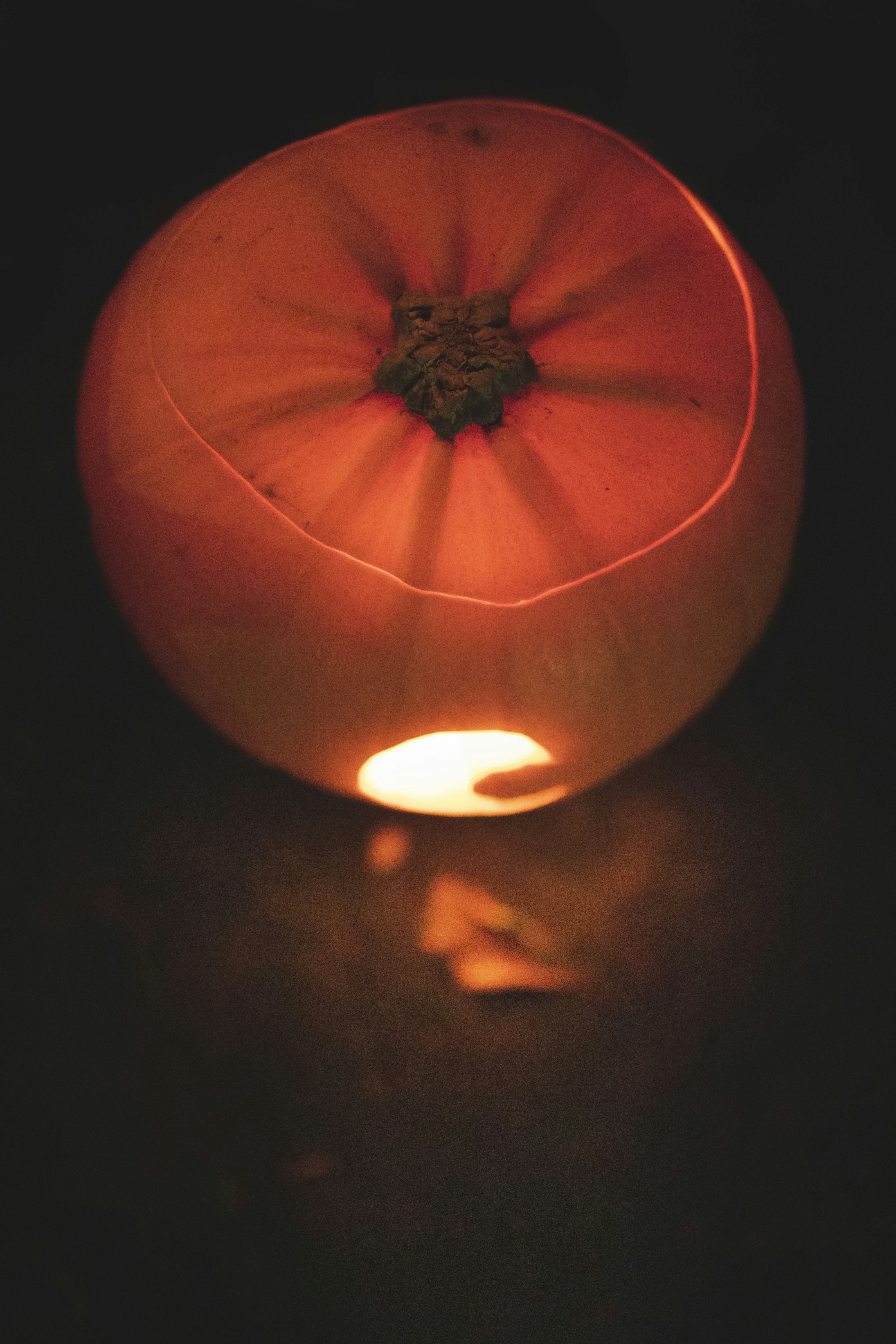 orange pumpkin with light in the middle