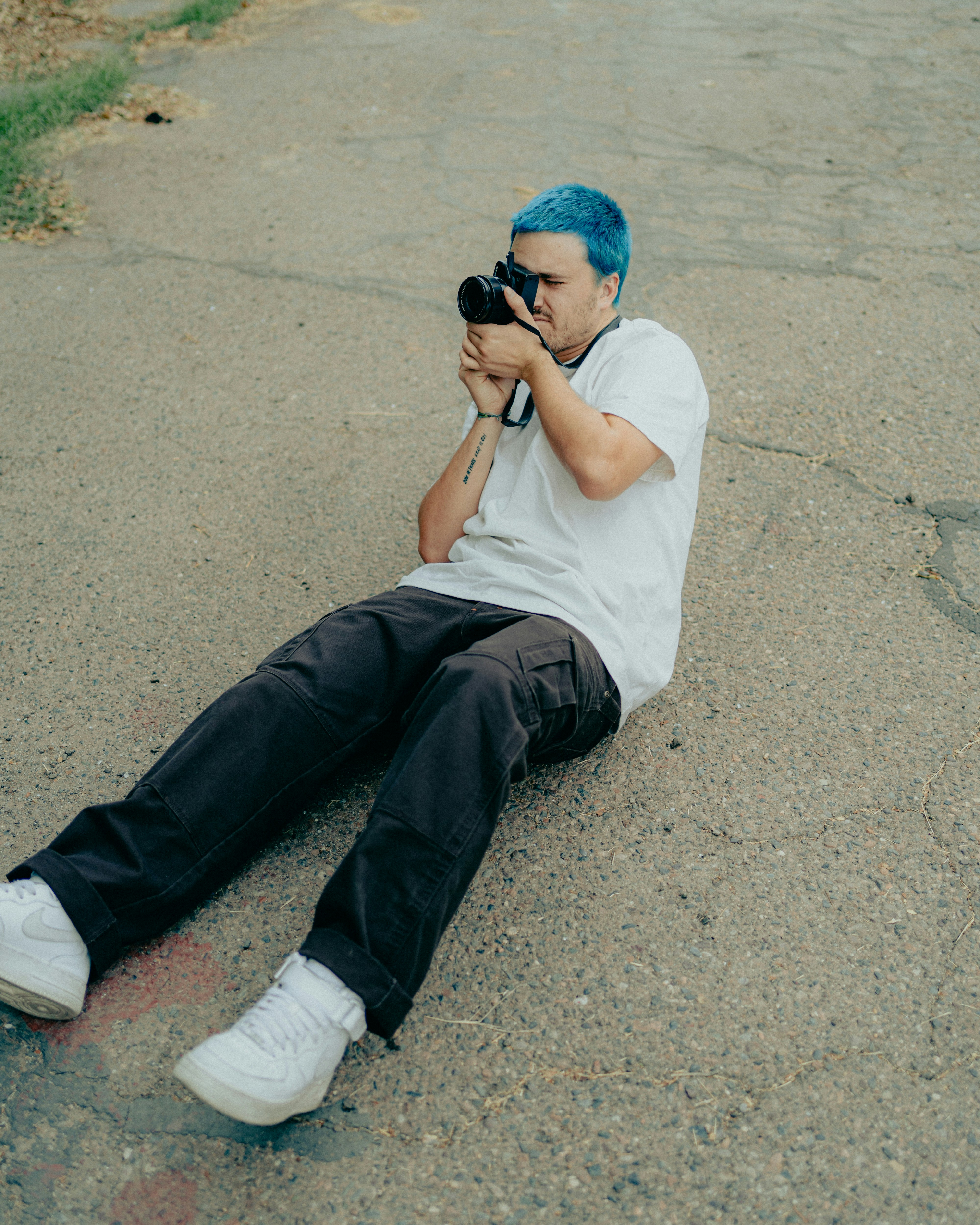 a gender fluid person with a haircut with saved sides