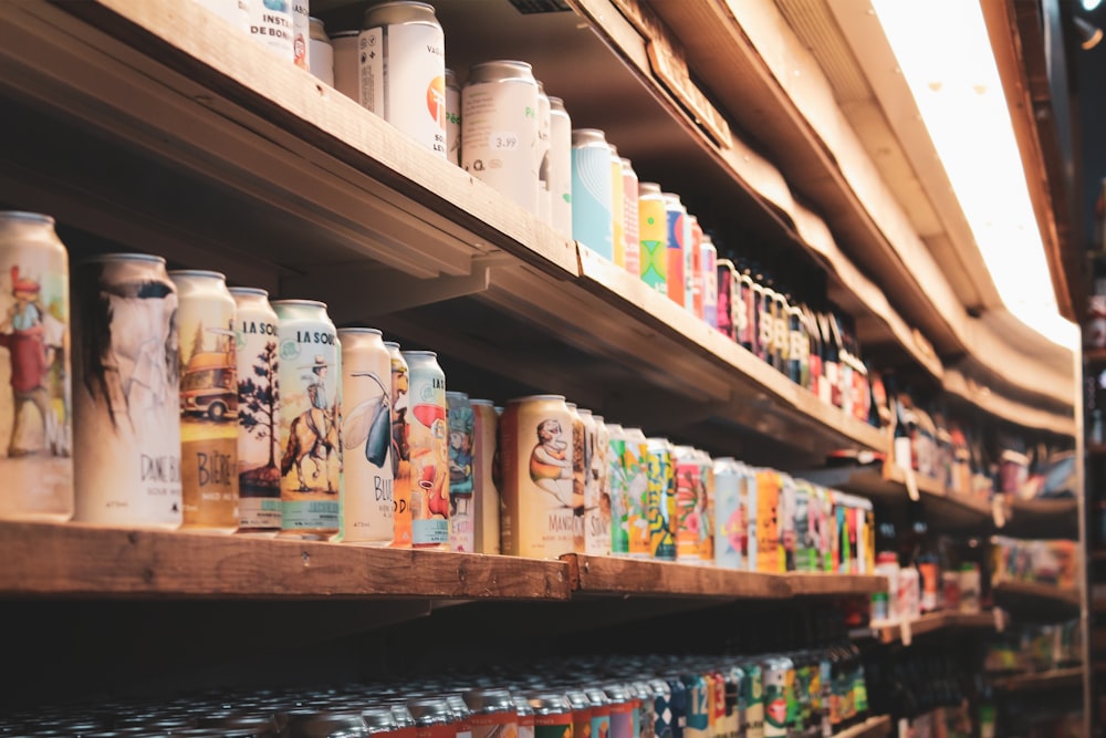 white and blue plastic bottles on brown wooden shelf