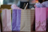 purple and white paper bags