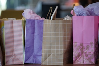 purple and white paper bags