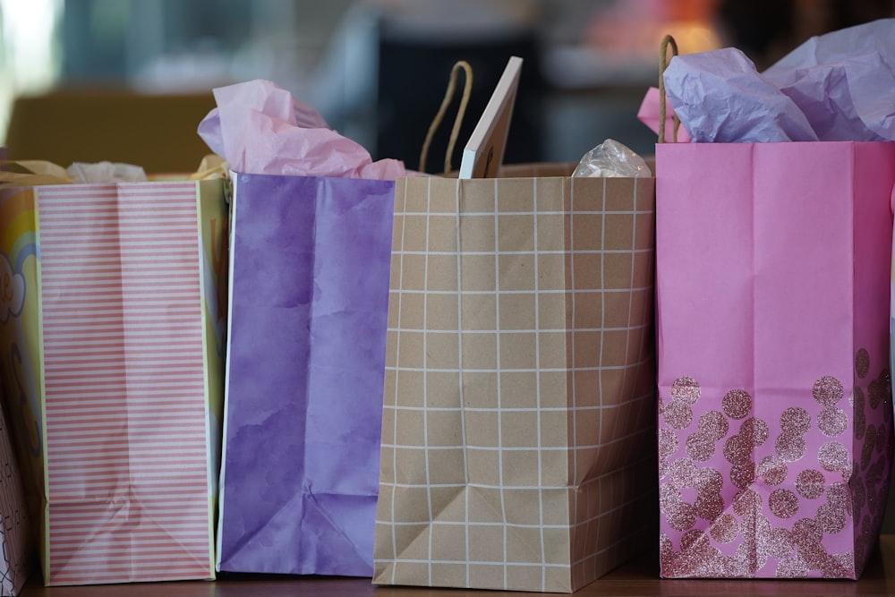 purple and white paper bags