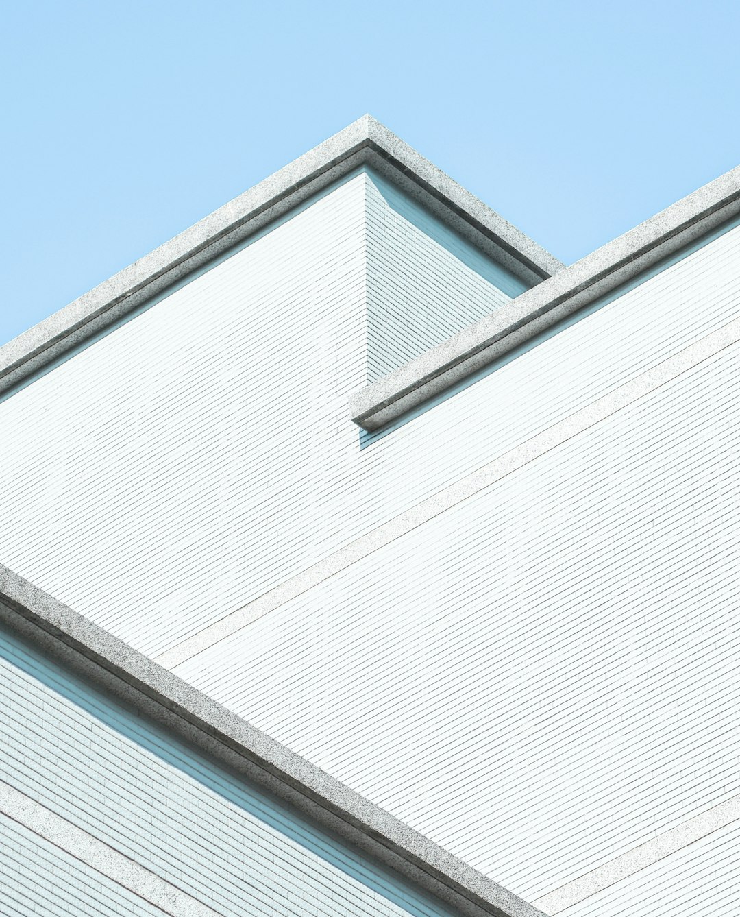 white concrete building under blue sky during daytime