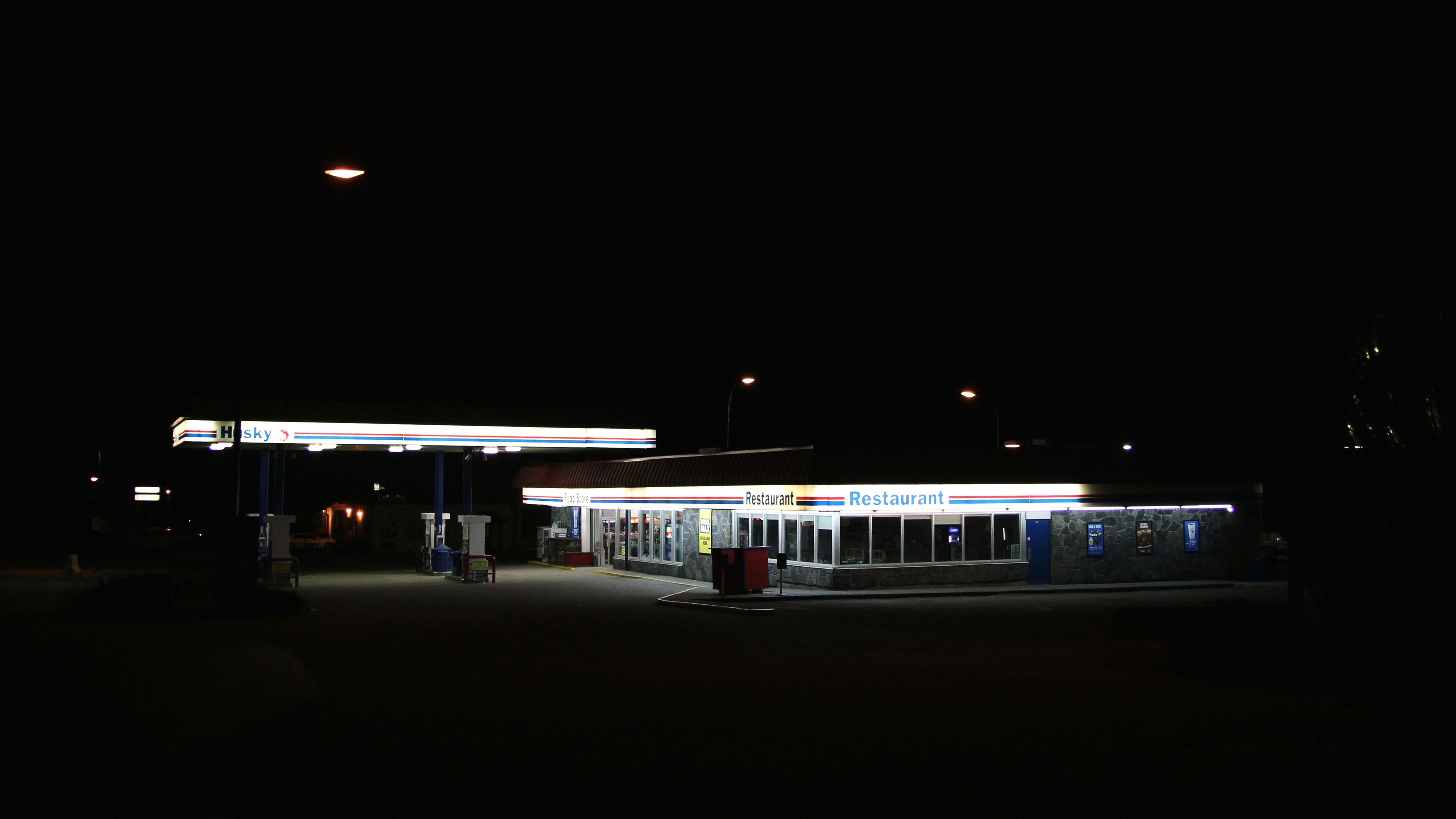 white train on rail during night time