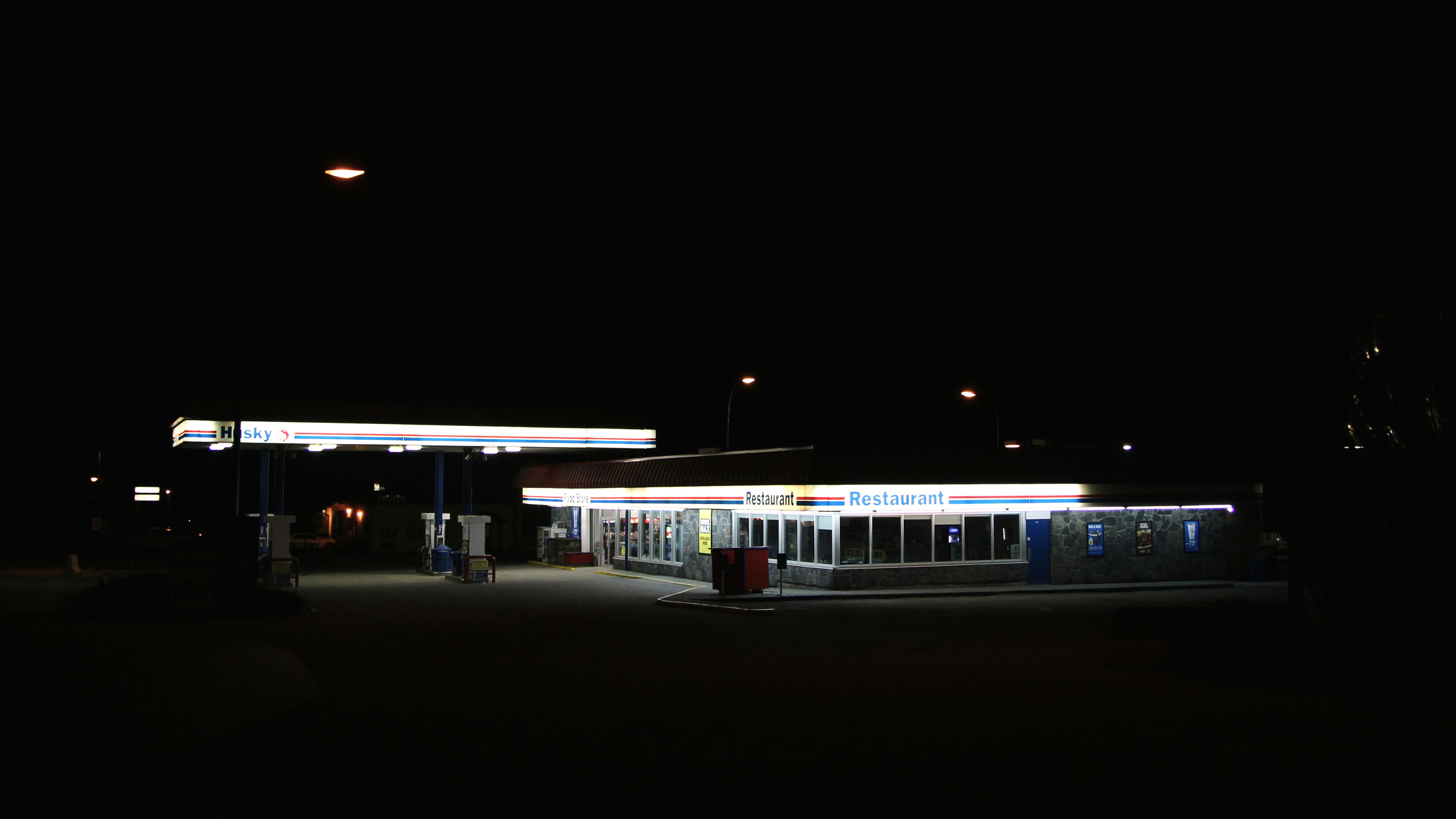 white train on rail during night time