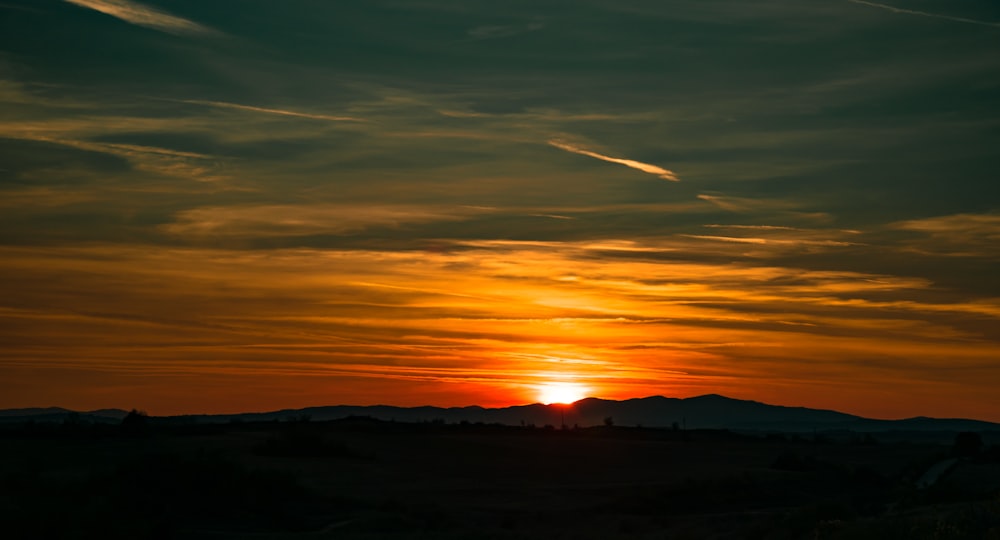 silhouette of mountain during sunset